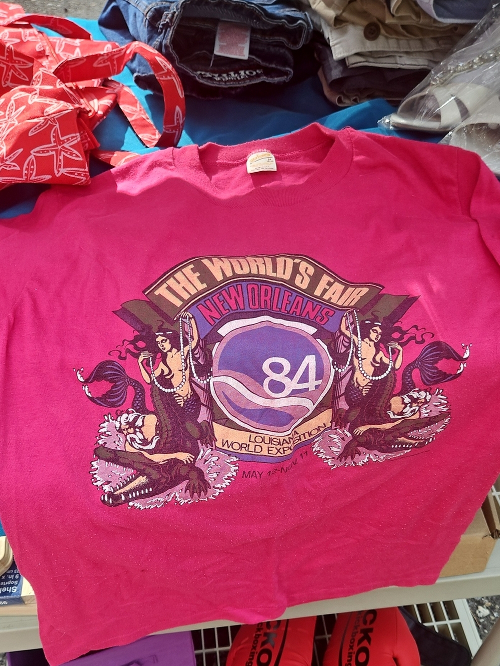 Pink 'The World's Fair New Orleans 84' Graphic T-shirt.